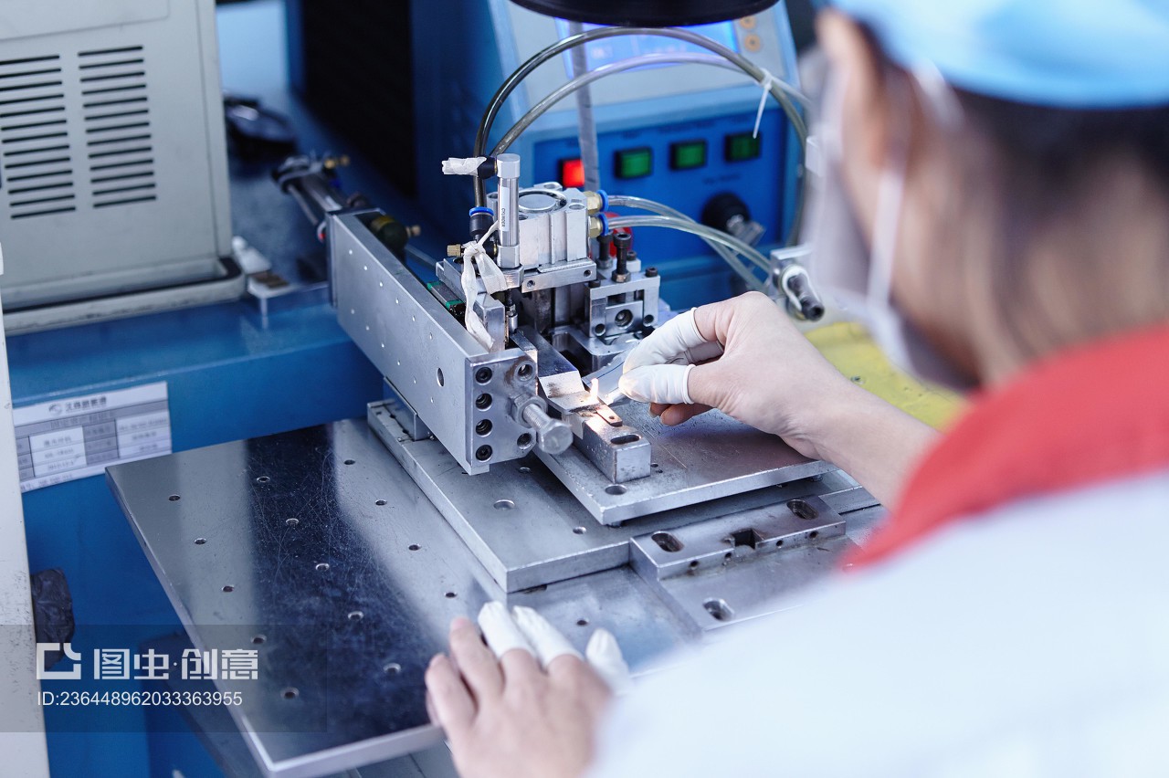 Worker at e-cigarettes battery factory, Guangdong, China
